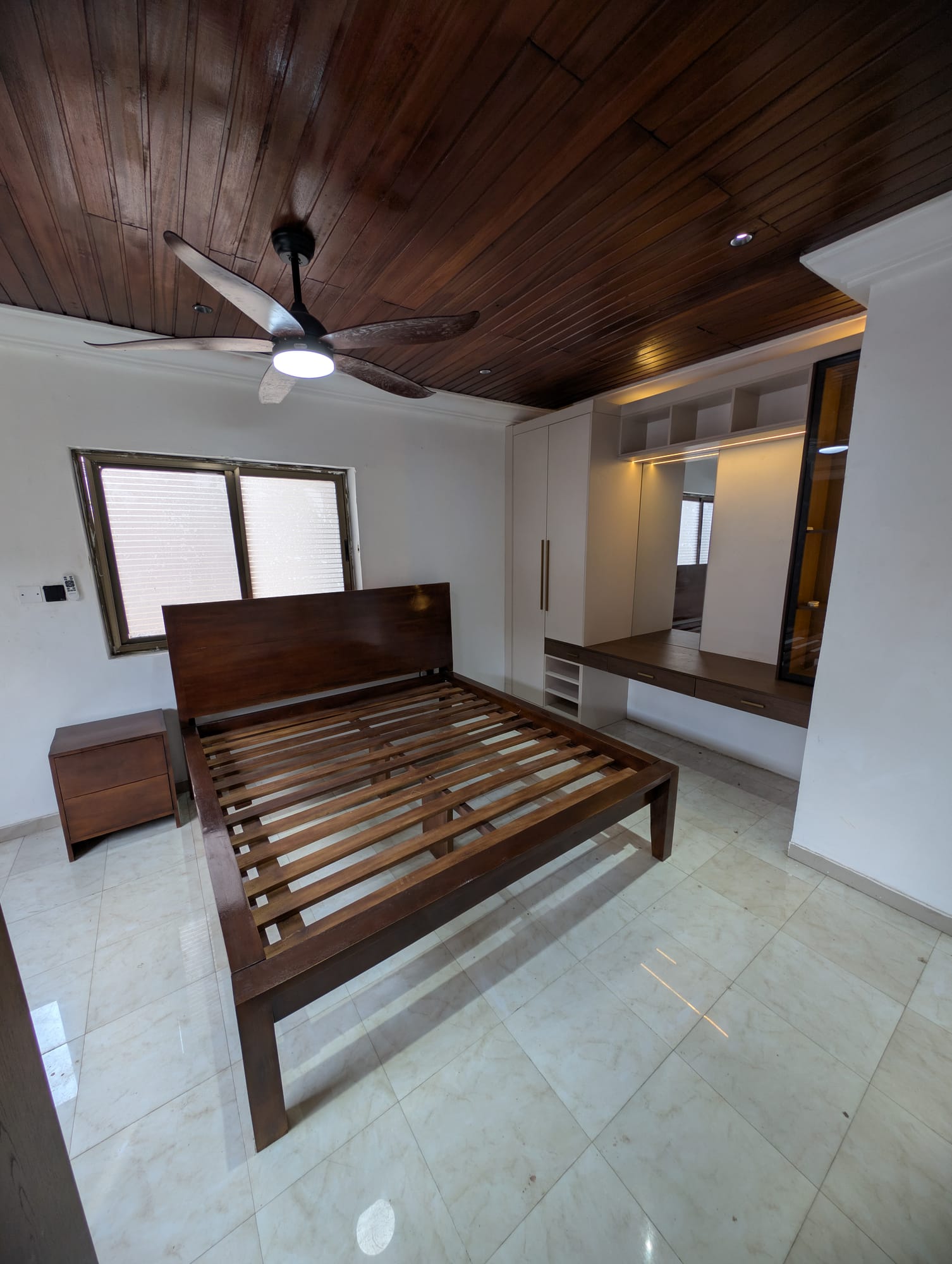 Queen bed with built-in wardrobe and vanity, Achimota guesthouse room conversion