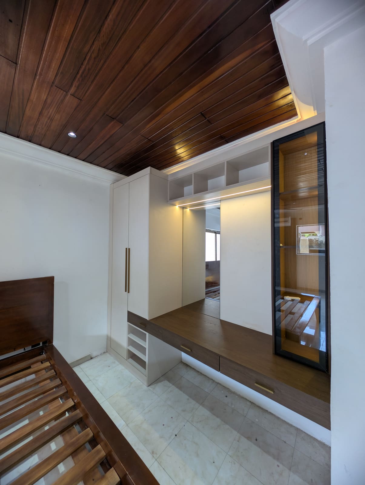 Lit black-framed glass display cabinet, angled view