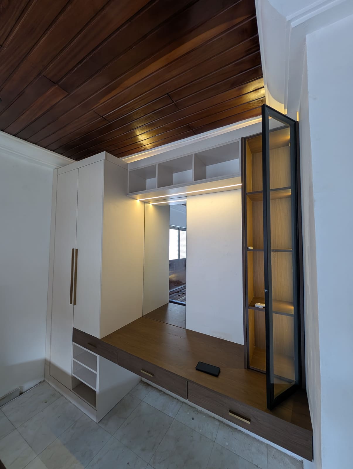 Built-in wardrobe with floating vanity desk and glass display cabinet, Achimota