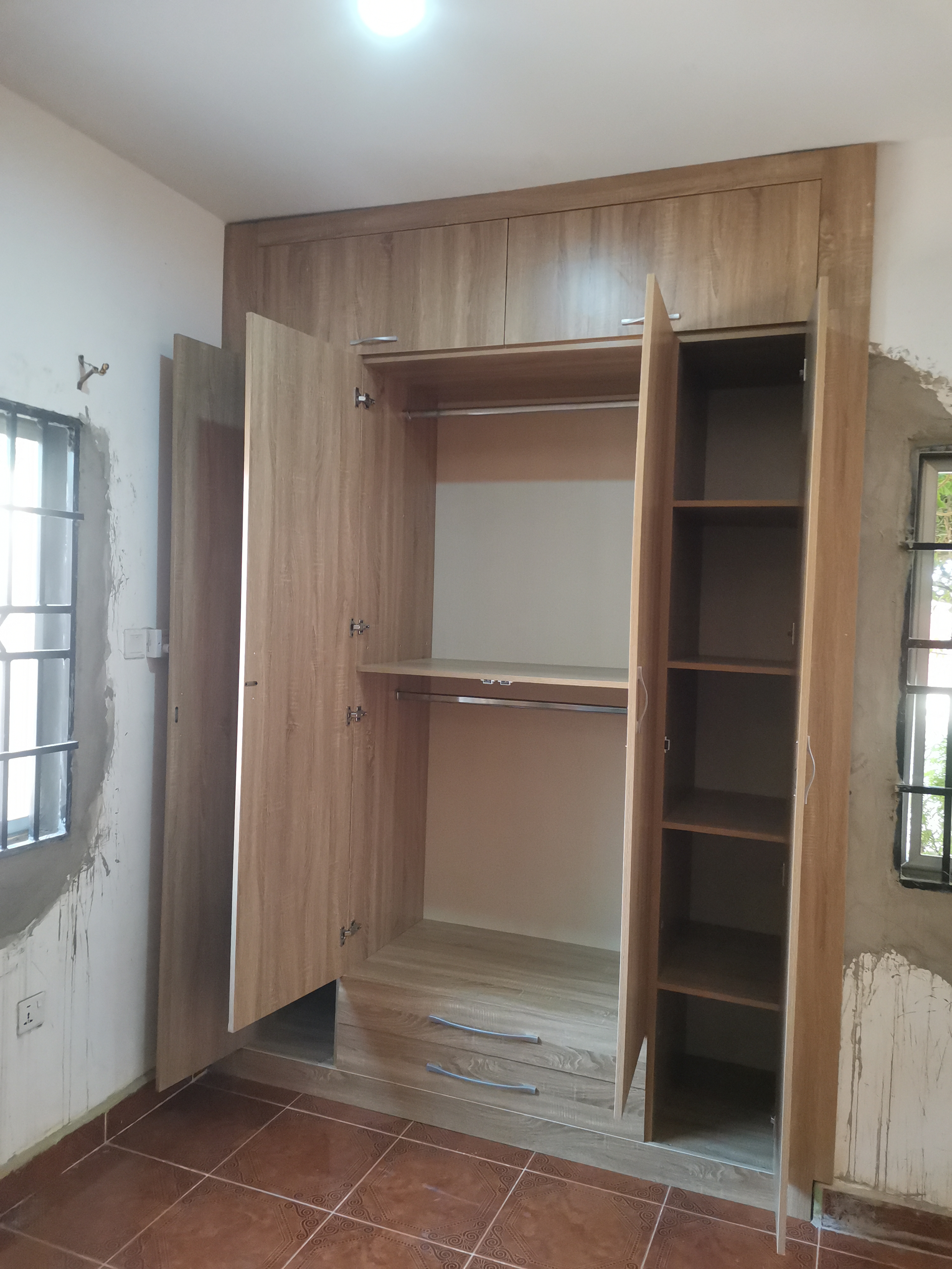 Floor-to-ceiling built-in wardrobe interior — Agbogba, Accra 2022