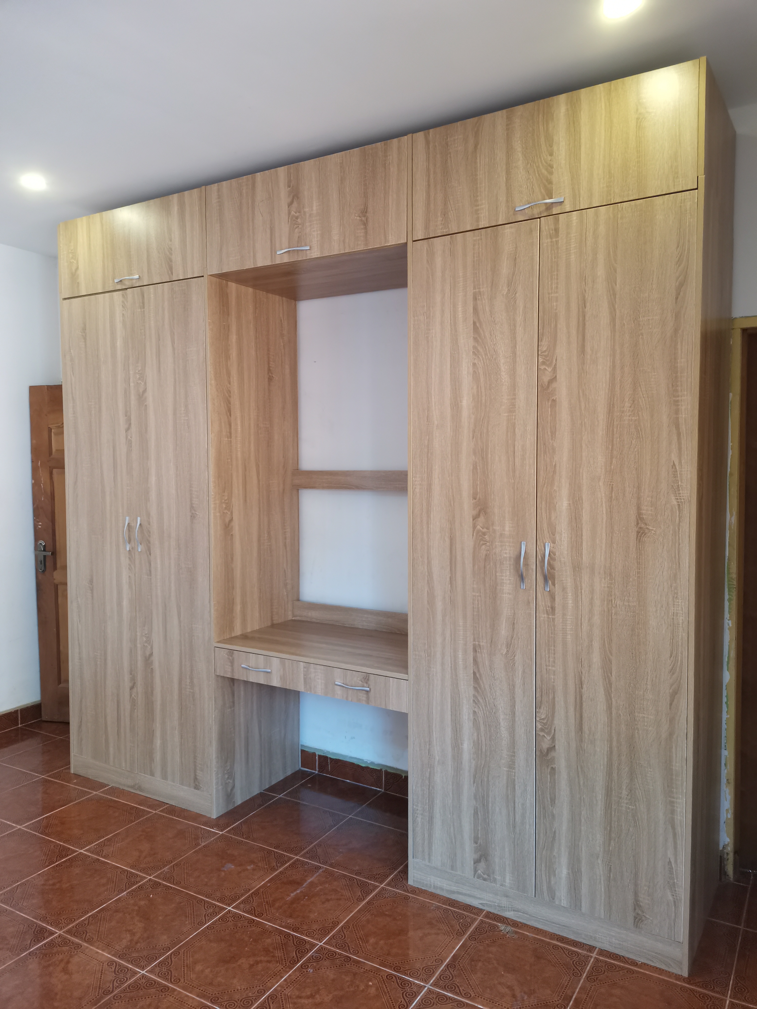 Full-width wardrobe with integrated dresser recess — Agbogba, Accra 2022