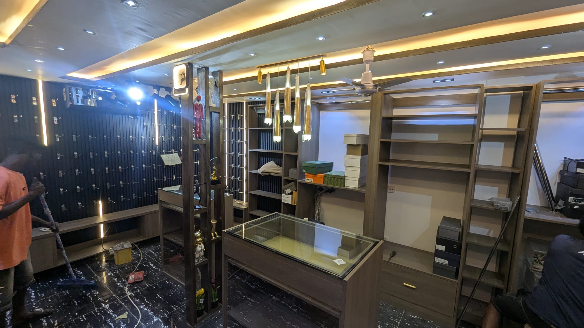 Retail fit-out with slatted feature walls and lit glass display counters