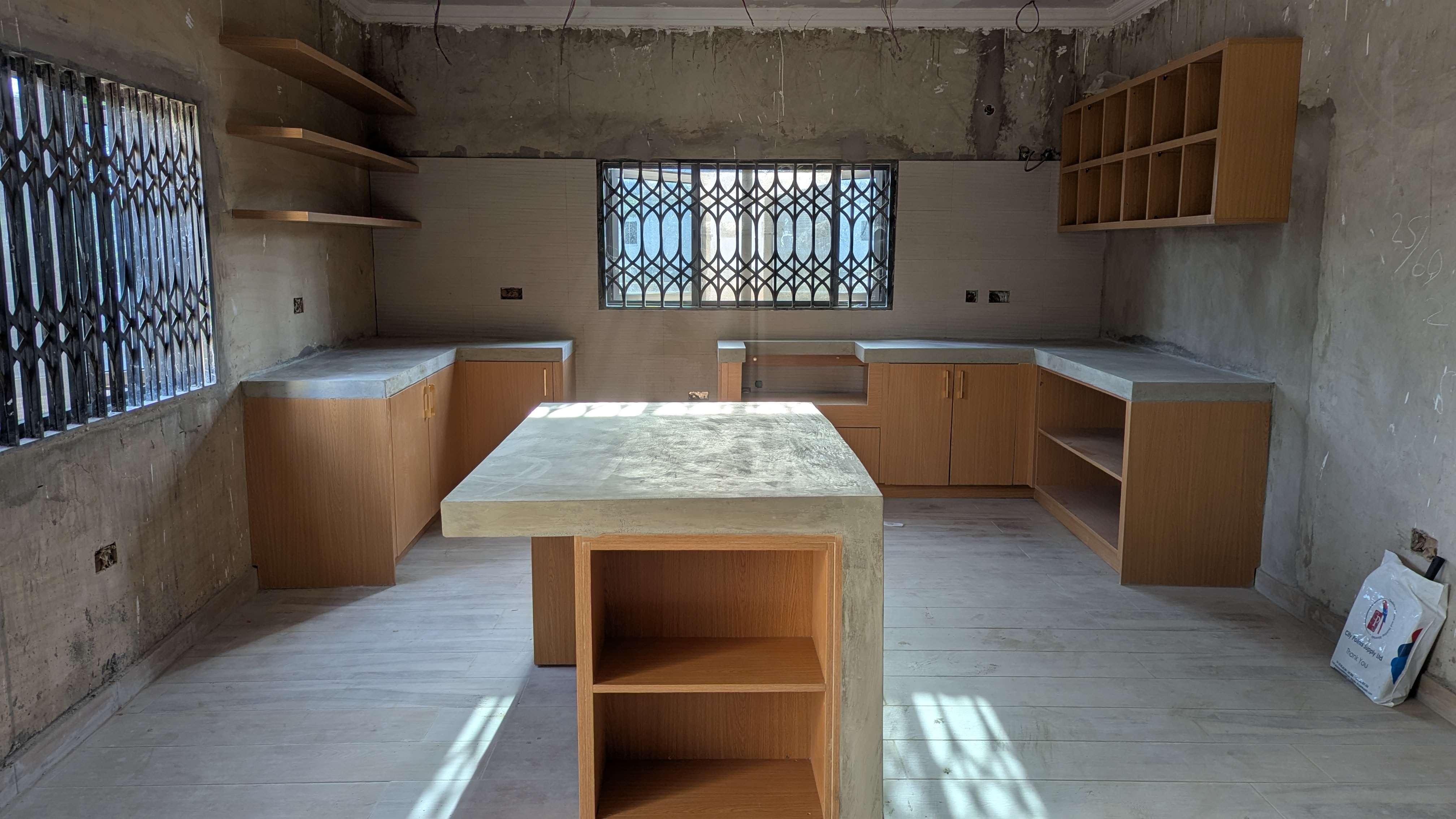 Mediterranean-inspired kitchen with sealed concrete countertops — Danfa