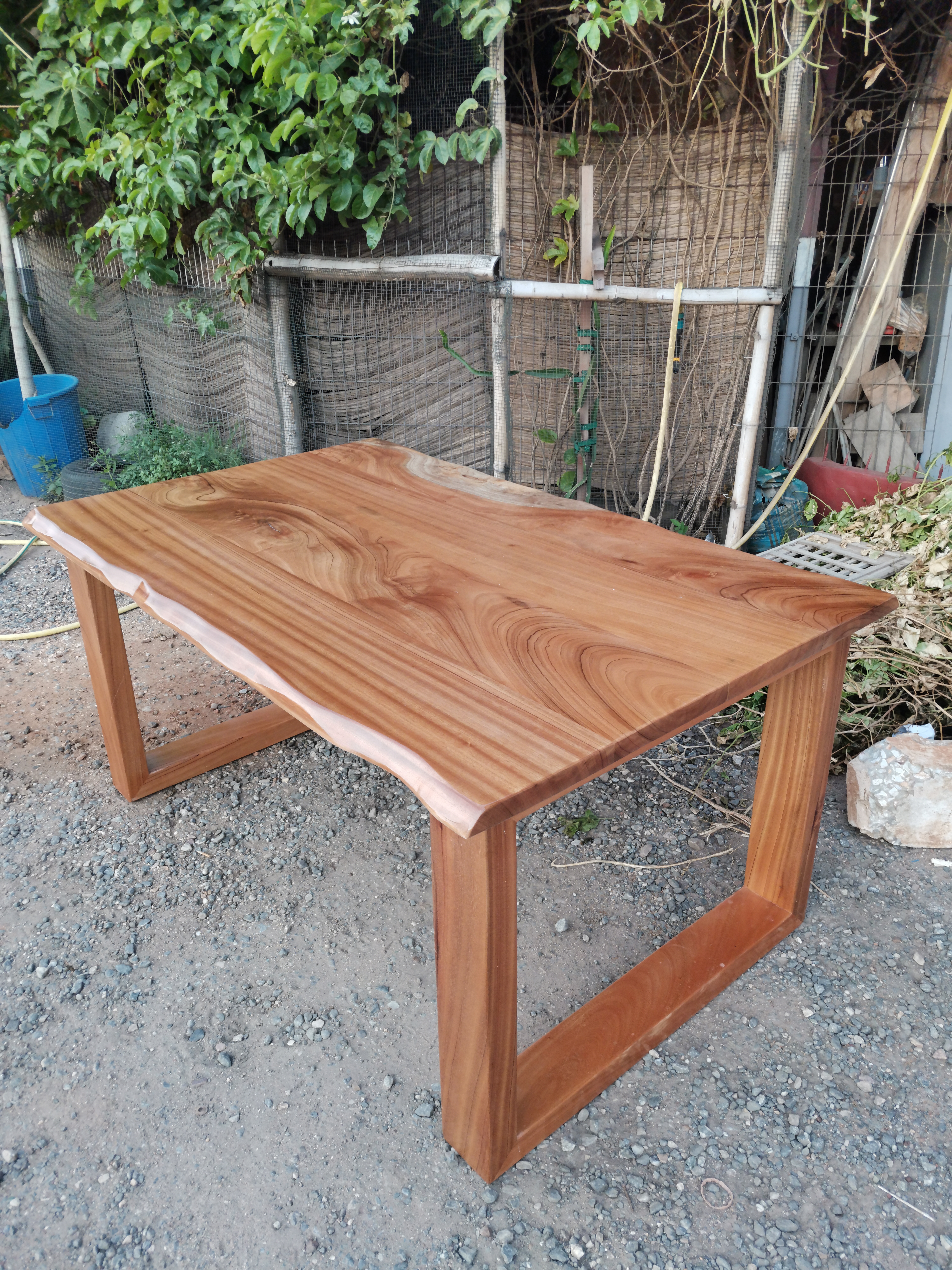 Afromosia live-edge dining table — honey tone and fine grain, Ridge, Accra