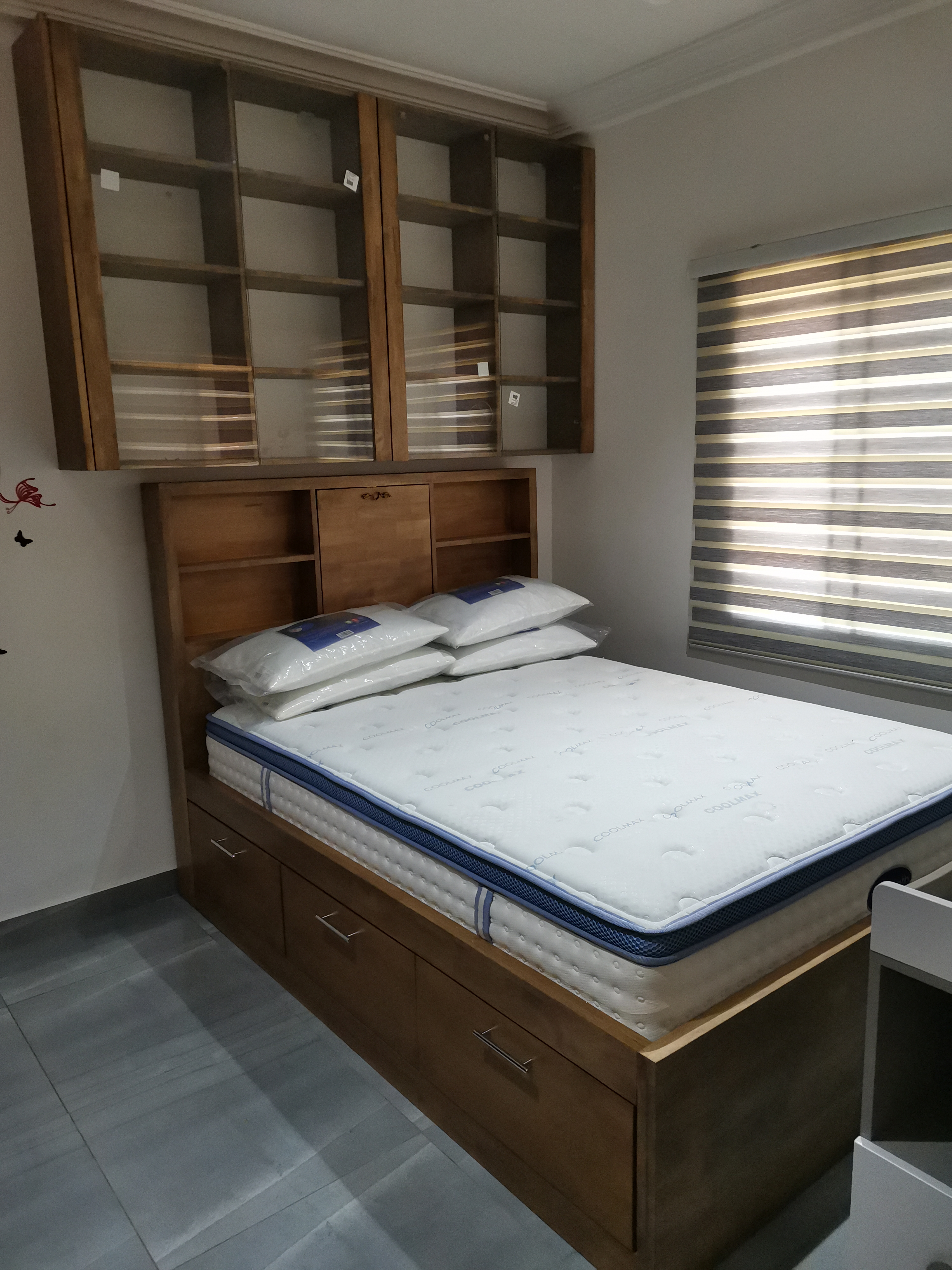 Custom storage bed with under-bed drawers and wall-mounted upper cabinet, Golf Hills, Accra