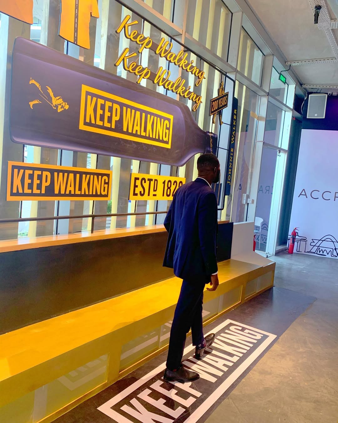 Wide angle of House of Walker Accra curved platform installation