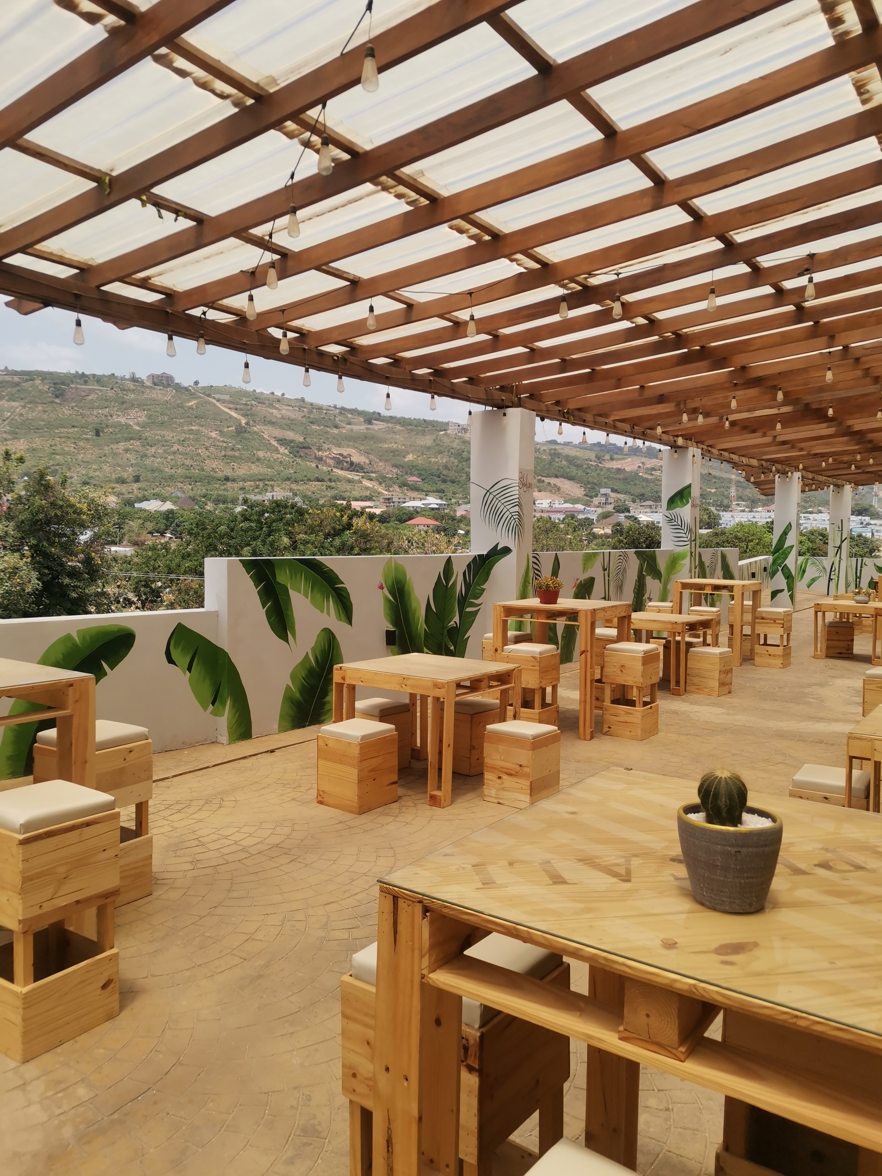 Jerksoul Restaurant rooftop — custom dining tables, cube stools, and bar counter built by Neewoody