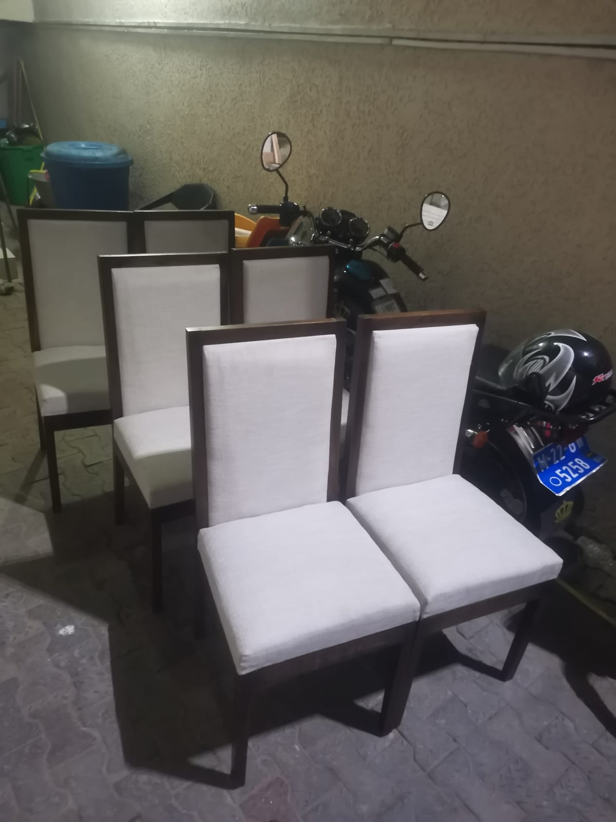 Hyedua dining chairs with cream linen upholstered seats and backs — detail