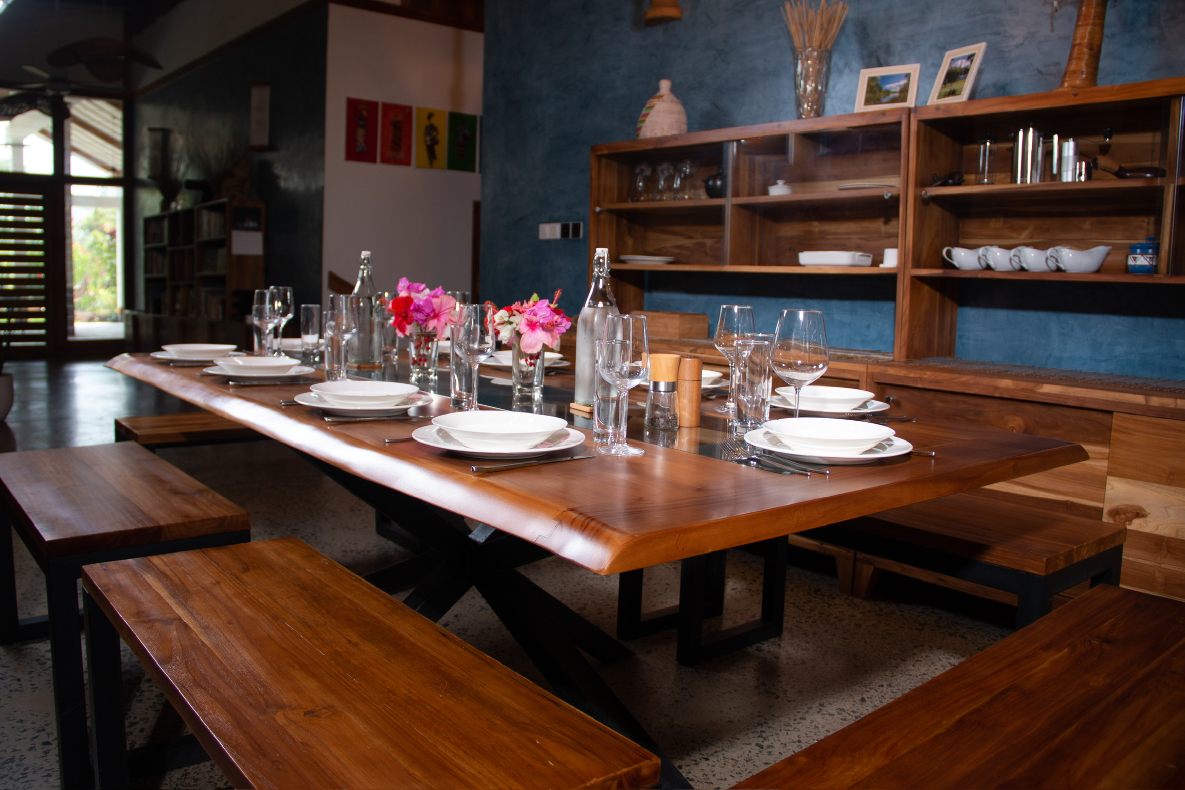 Live edge teak dining table detail showing natural grain