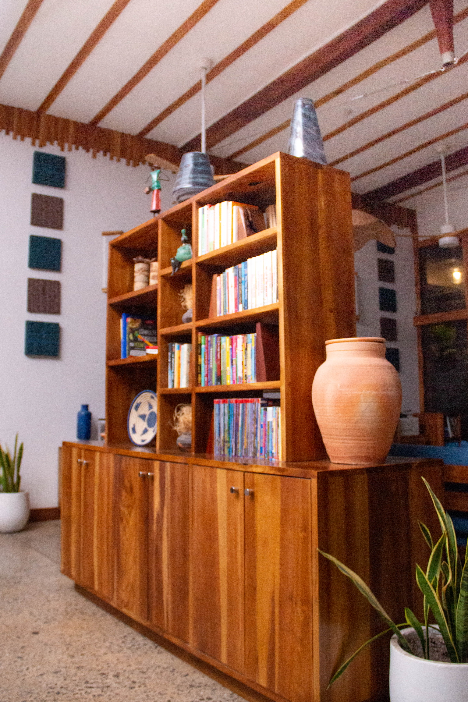 Solid teak bookshelf unit with lower cabinet storage