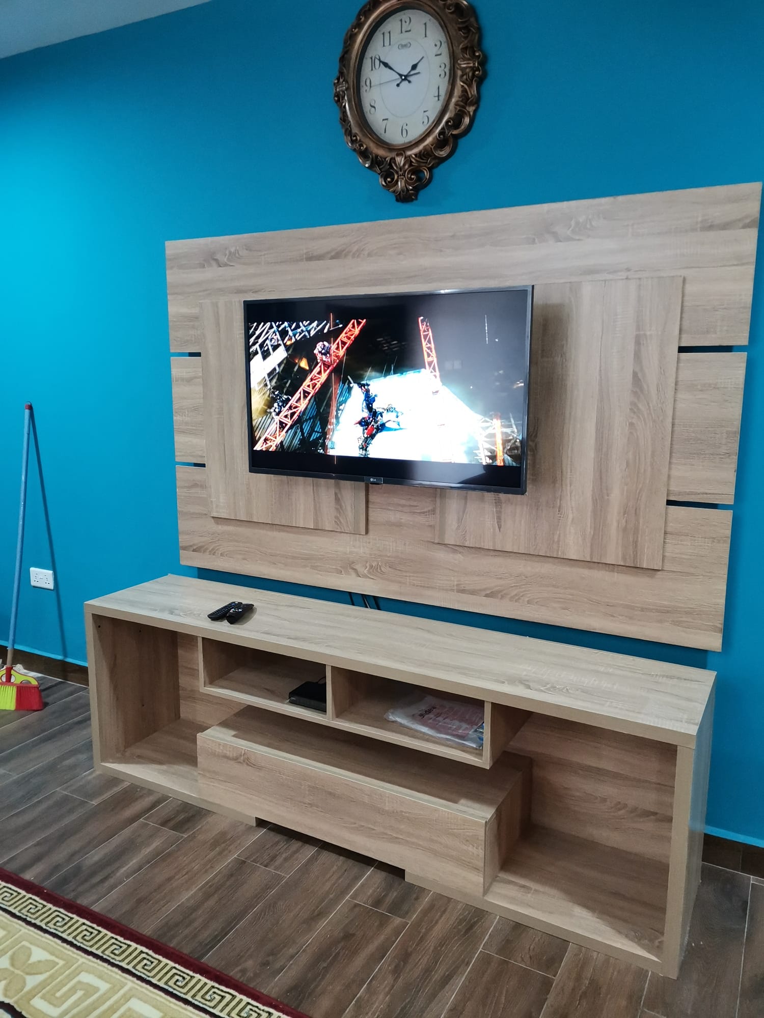 Floor-to-ceiling feature-wall TV unit with mounted TV, Accra